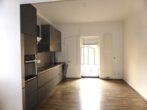 Stilvoll sanierte 2-Zimmer-Wohnung mit Garten in ruhiger Lage - Küche mit Zugang zum Hinterhof